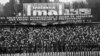 Pe 1 mai 1886, organizația care acum este cunoscută drept American Federation of Labour a organizat un protest la scară largă pentru a cere o zi de muncă de opt ore.<br />
<br />
Masacrul din acea zi pentru oprirea grevelor a ajuns să fie comemorat de socialiștii din întreaga lume, inclusiv în&nbsp;Republica Socialistă România, ca de exemplu în imagine de la o festivitate din 1973.