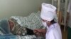 Tajikistan - a doctor and his patient, Dushanbe, Nov2009