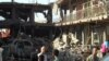 Кабулдун Шах Шахид райондагы жанкечти жардырган бомбадан кыйраган үйлөр. 7-август 2015