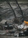 Перевернутыеавтомобили и сломанные деревья после наводнения в Техасе, 5 июля 2025 года