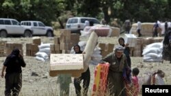 آوارگان کوهستان قندیل در مرز ایران و عراق پس از حمله توپخانه‌ ای سپاه پاسداران.