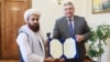 Орусиянын тышкы иштер министринин орун басары Андрей Руденко жана Ооганстандын элчиси Гүл Хасан. Москва. 3-июль, 2024-жыл.
