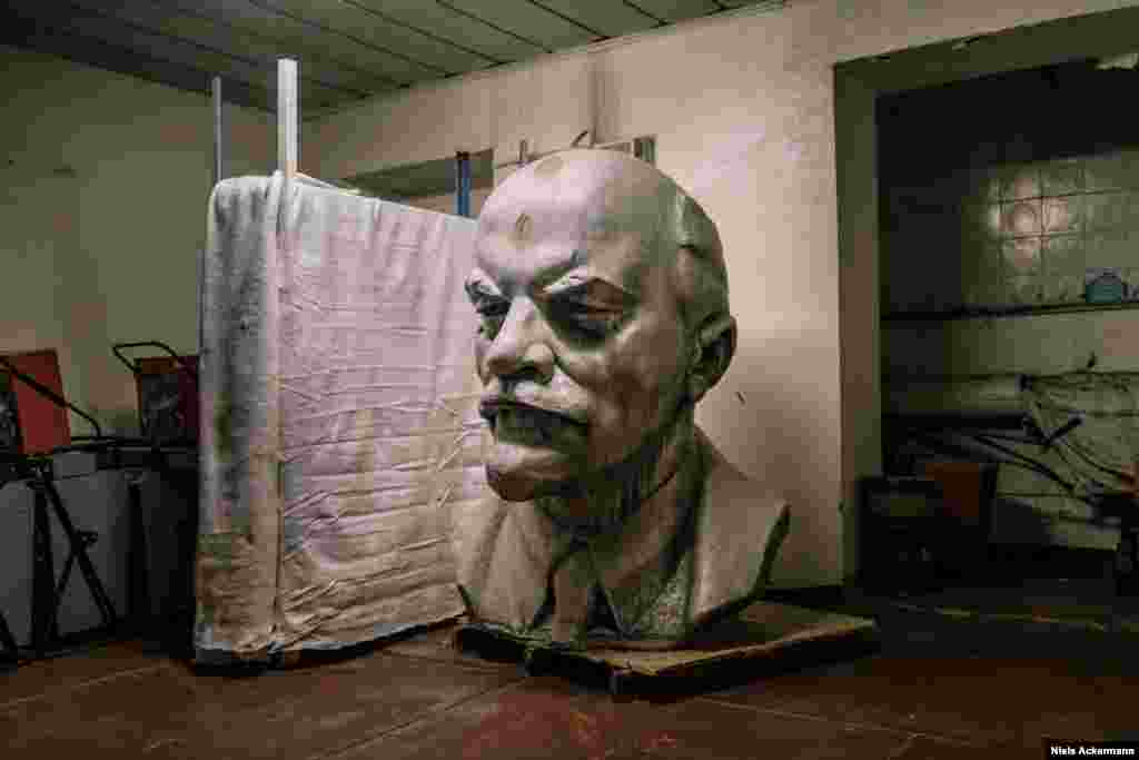 A giant Lenin in a storage room in Chernobyl. Ackermann was initially told by the local authorities that the head was too radioactive to be safely photographed. 
