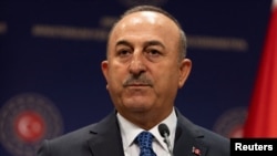 Turkey - Turkish Foreign Minister Mevlut Cavusoglu attends a news conference with British Foreign Secretary Liz Truss in Ankara, June 23, 2022.